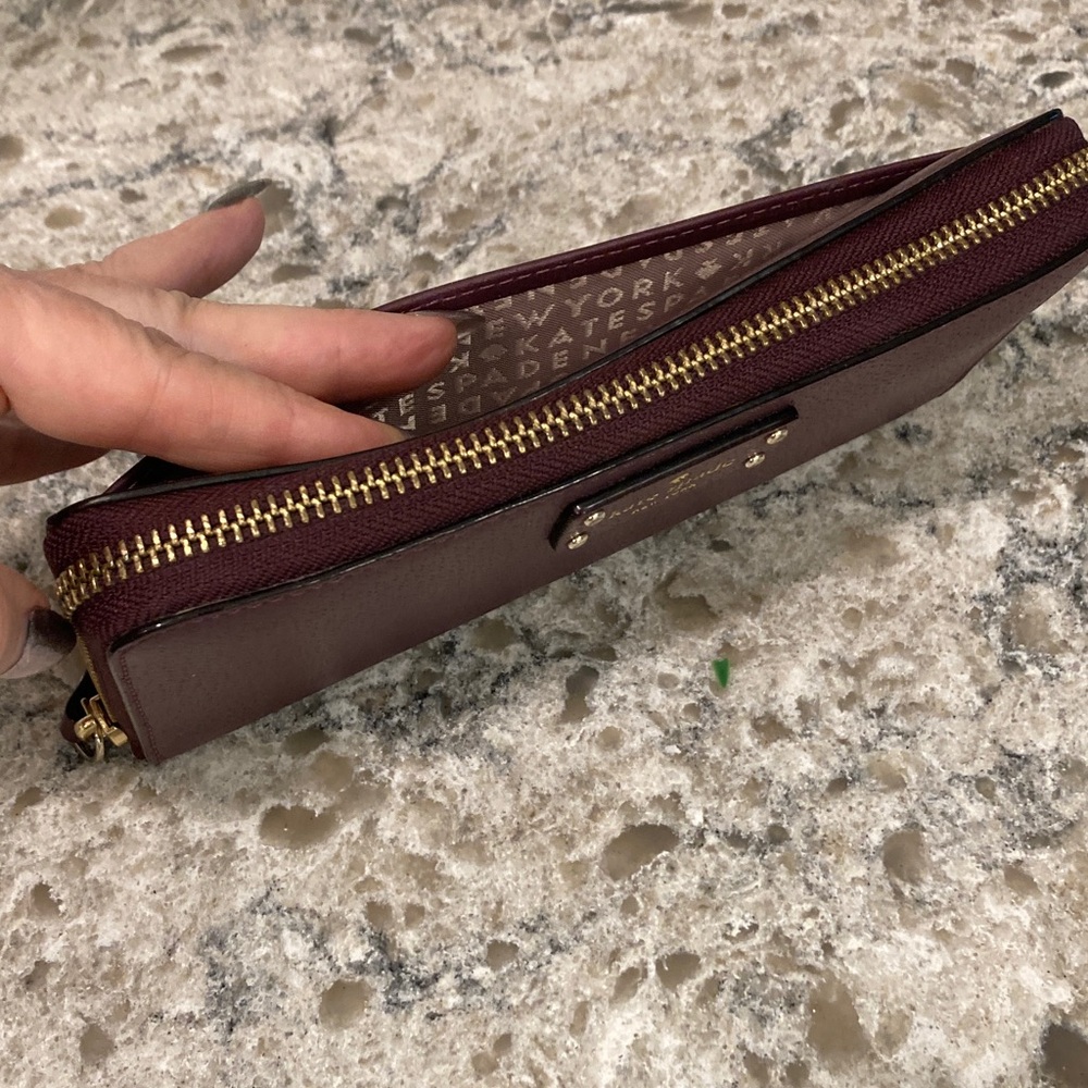 Kate Spade top zip maroon wallet
EXCELLENT CONDITION I have matching crossbody - Picture 6 of 7